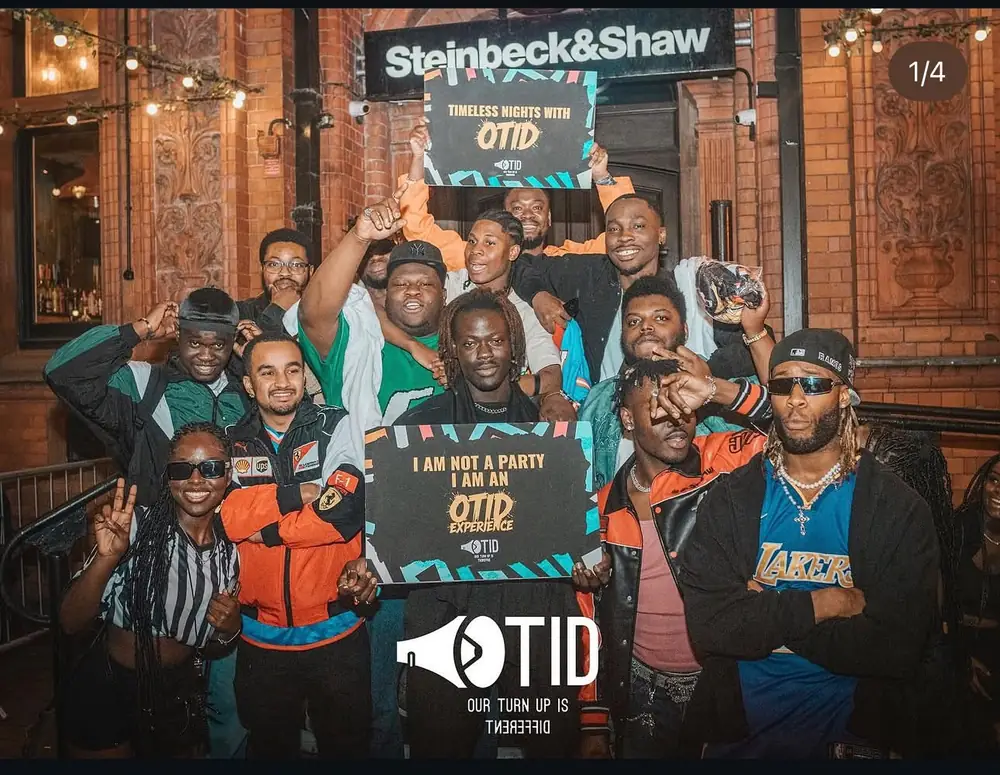 The OTID team outside Steinbeck and Shaw holding OTID signs