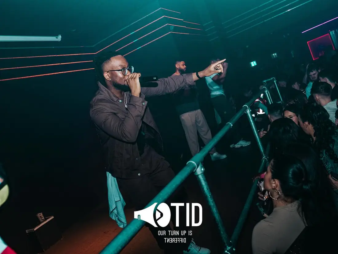 A performer reaching towards the crowd at an OTID show